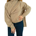 Woman wearing camel knit with shawl collar