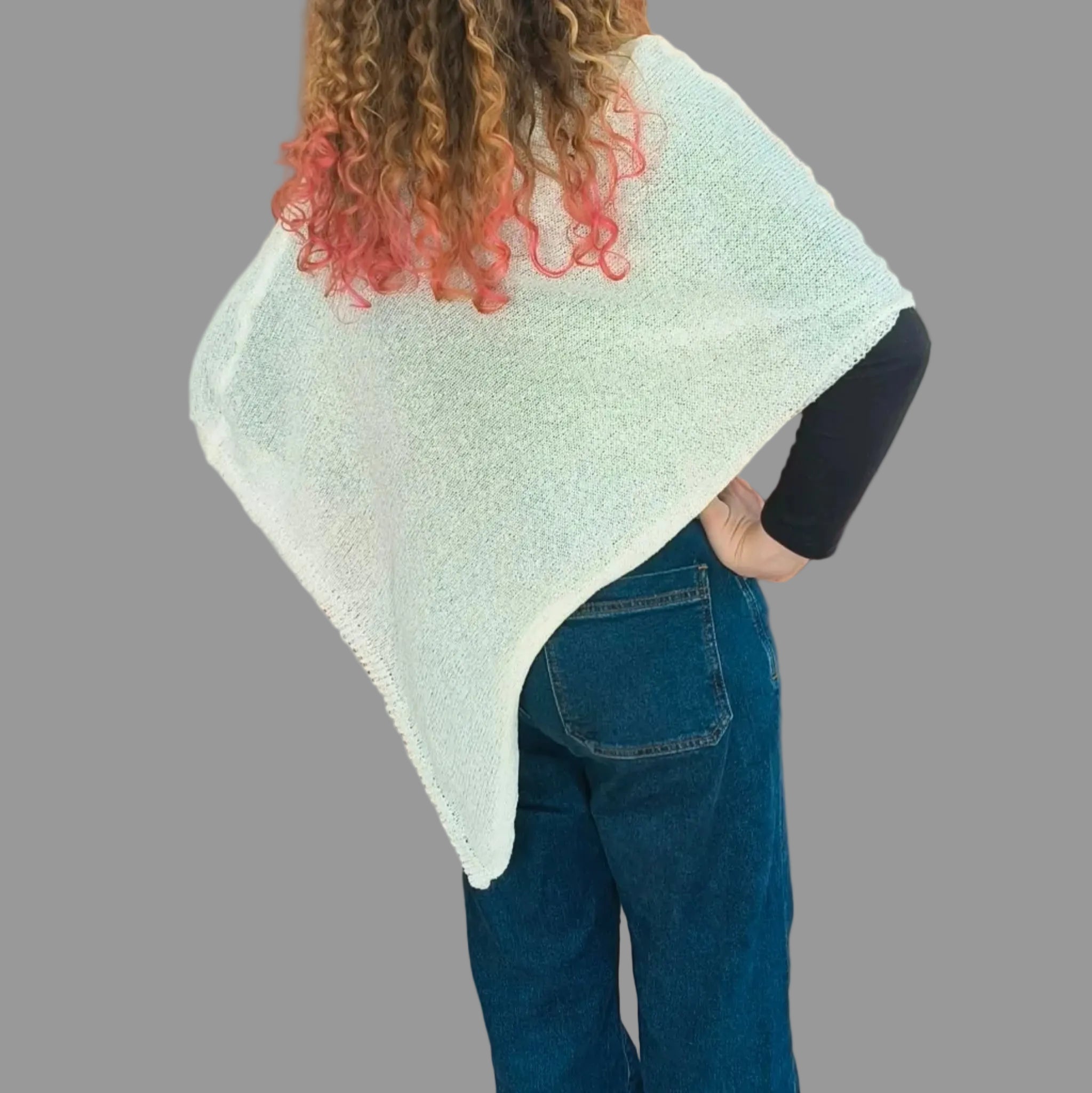 Woman wearing elegant cream shawl 