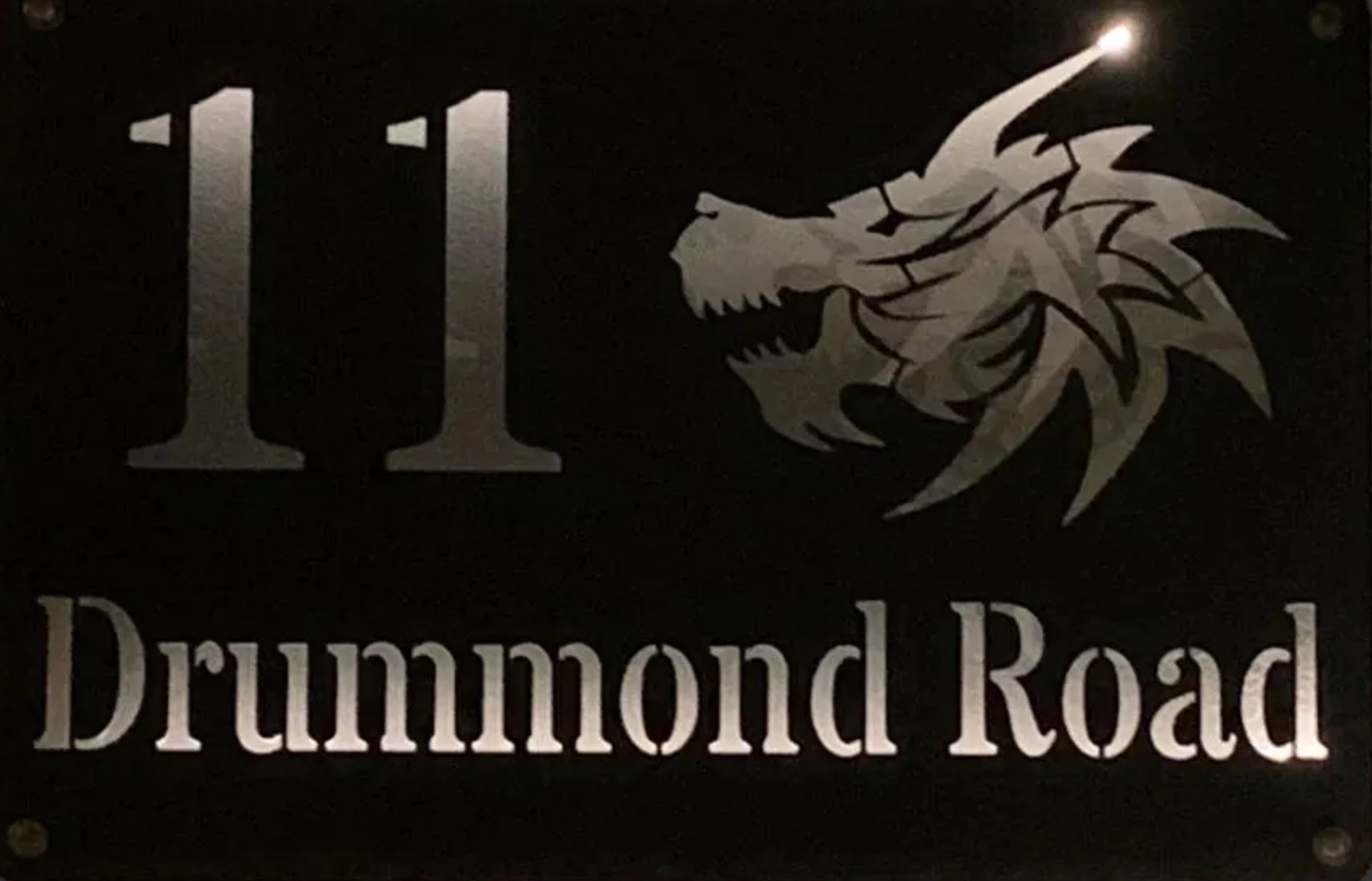 House sign with dragon design